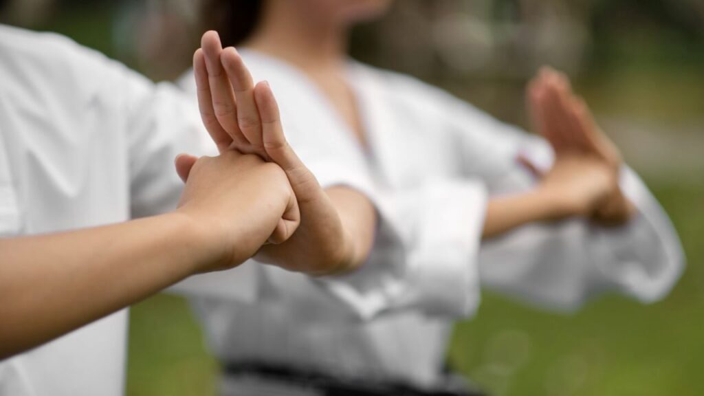 Qigong practice combining movement, breathing, and focus for overall well-being.